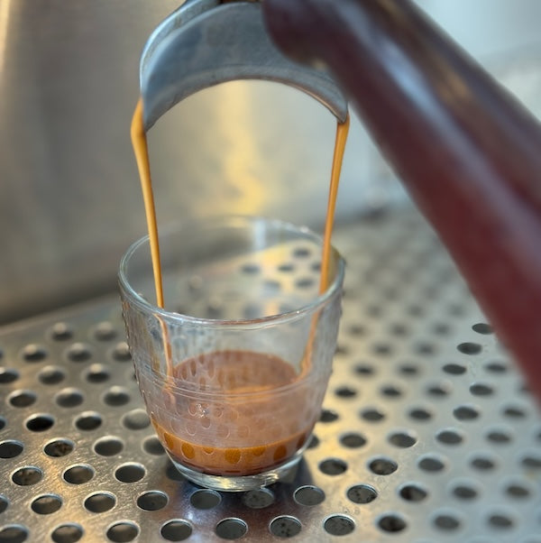Pouring an espresso shot at The Town Roaster