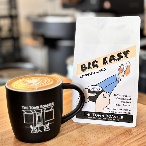 The Town Roaster Big Easy Espresso Blend with a mug of coffee