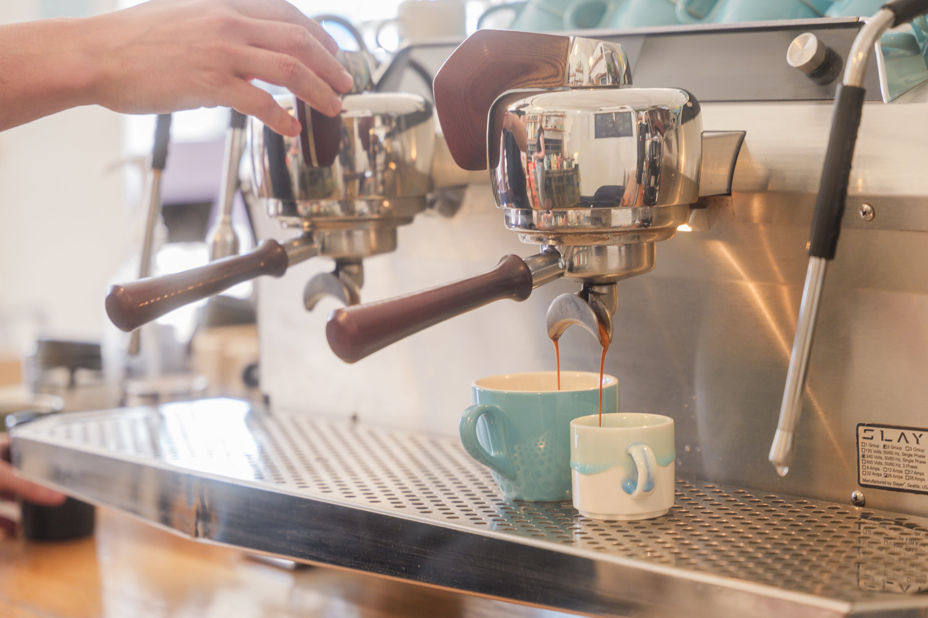 Making espresso shots on the Slayer coffee machine at The Town Roaster