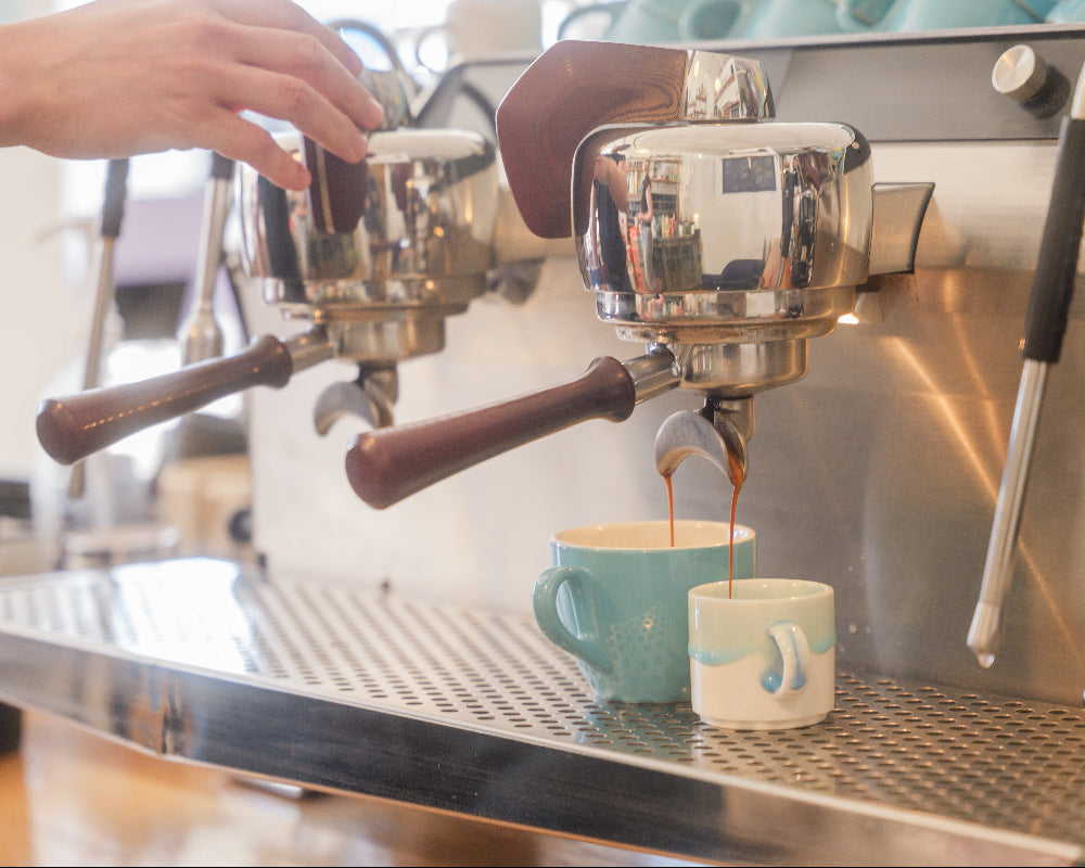 Slayer coffee machine pouring espresso shots